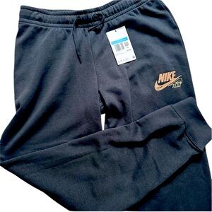 Women’s black Nike Jogger Pants by with gold glitter logo size M NWT